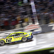 Ryan Blaney crosses the finish line at 2022's NASCAR All-Star Race. His window net has fallen after he attempted to re-secure it.